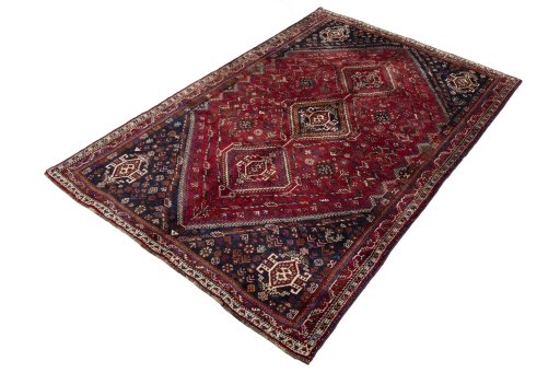 Corner detail of 2000s Shiraz rug showing border pattern and Wool pile