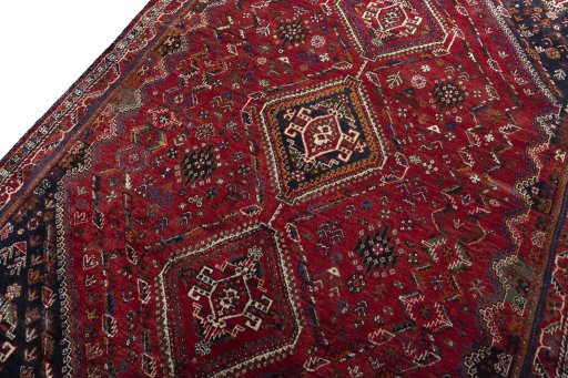 Backside of handmade 2000s Shiraz rug showing knot structure and weave density