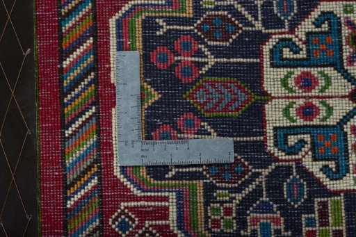 Backside of handmade 2000s Shiraz rug showing knot structure and weave density