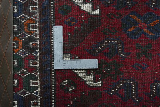 Backside of handmade 2000s Shiraz rug showing knot structure and weave density