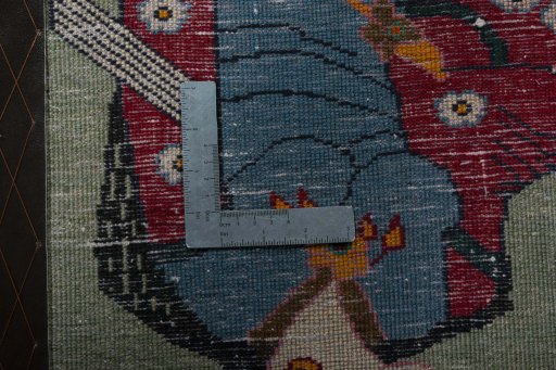 Backside of handmade 2000s Shiraz rug showing knot structure and weave density