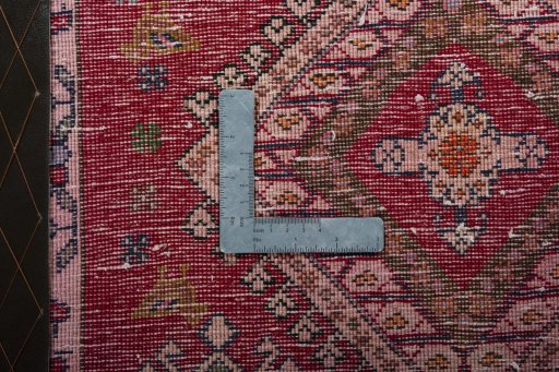 Backside of handmade 2000s Shiraz rug showing knot structure and weave density