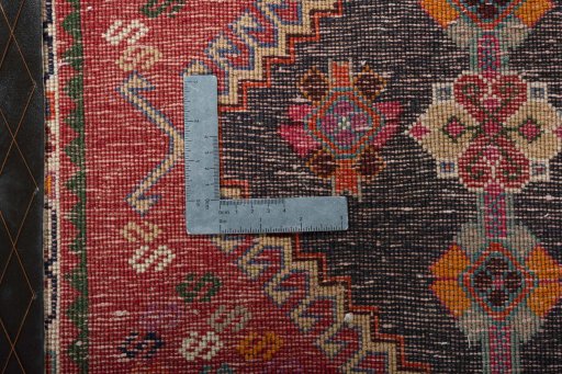 Backside of handmade 2000s Shiraz rug showing knot structure and weave density