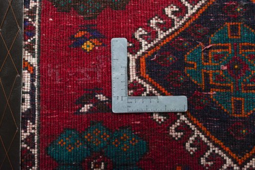 Backside of handmade 2000s Shiraz rug showing knot structure and weave density