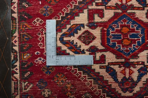 Backside of handmade 2000s Shiraz rug showing knot structure and weave density