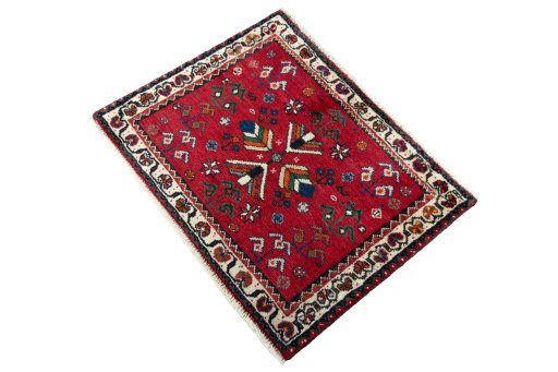 Corner detail of 2000s Shiraz rug showing border pattern and Wool pile