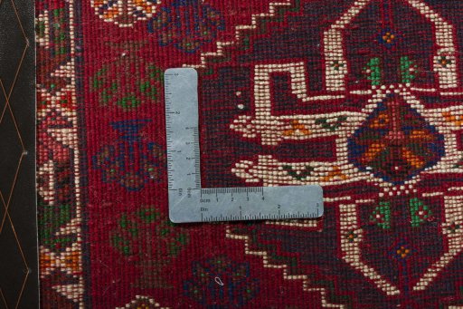 Backside of handmade 2000s Shiraz rug showing knot structure and weave density
