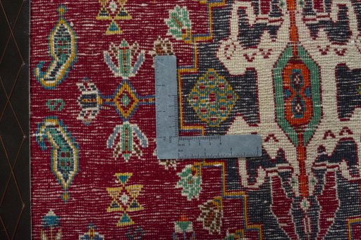 Backside of handmade 2000s Shiraz rug showing knot structure and weave density