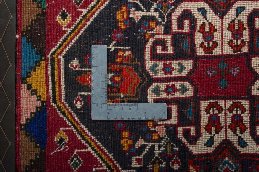 Backside of handmade 2000s Shiraz rug showing knot structure and weave density