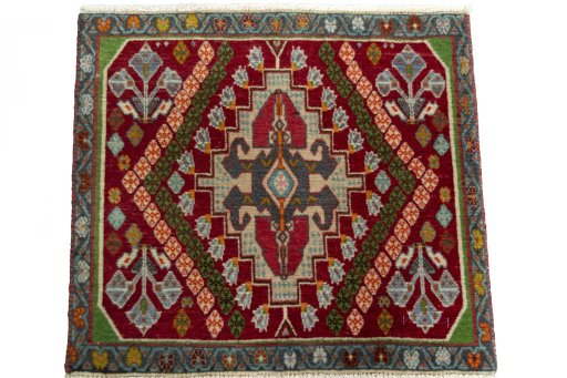 Surface texture of 2000s Shiraz rug with natural Wool and intricate pattern