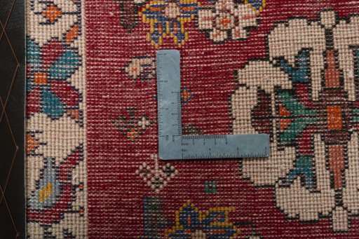 Backside of handmade 2000s Shiraz rug showing knot structure and weave density