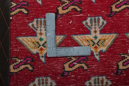 Backside of handmade 2000s Shiraz rug showing knot structure and weave density