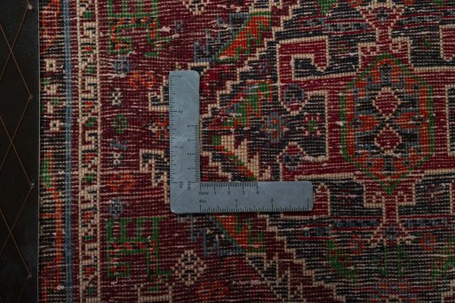 Backside of handmade 2000s Shiraz rug showing knot structure and weave density