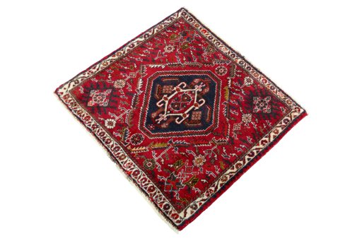 Corner detail of 2000s Shiraz rug showing border pattern and Wool pile