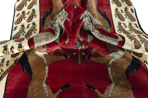 Corner detail of 2000s Shiraz rug showing border pattern and Wool pile