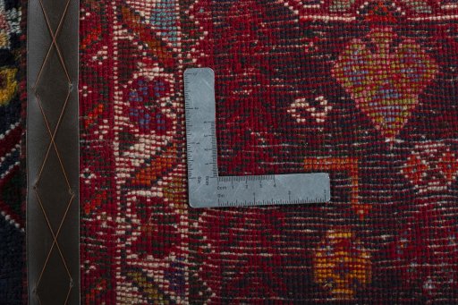 Surface texture of 2000s Shiraz rug with natural Wool and intricate pattern