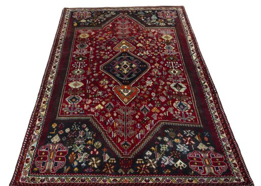 Surface texture of 2000s Shiraz rug with natural Wool and intricate pattern