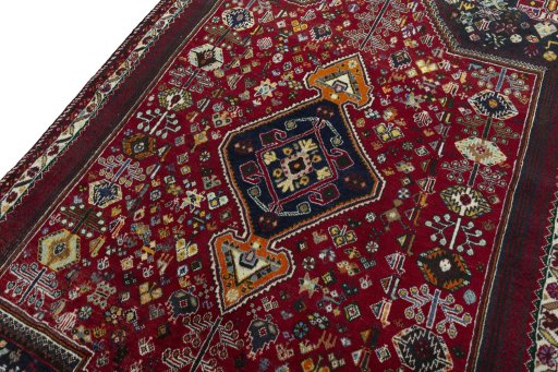 Backside of handmade 2000s Shiraz rug showing knot structure and weave density