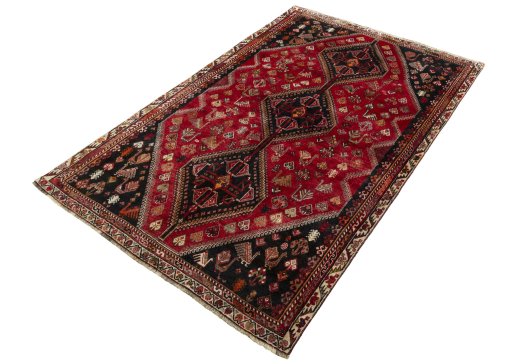 Corner detail of 2000s Shiraz rug showing border pattern and Wool pile
