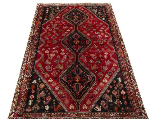 Surface texture of 2000s Shiraz rug with natural Wool and intricate pattern