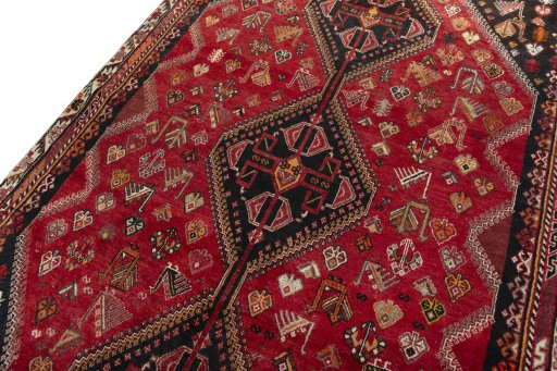 Backside of handmade 2000s Shiraz rug showing knot structure and weave density