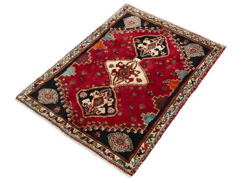 Corner detail of 2000s Shiraz rug showing border pattern and Wool pile