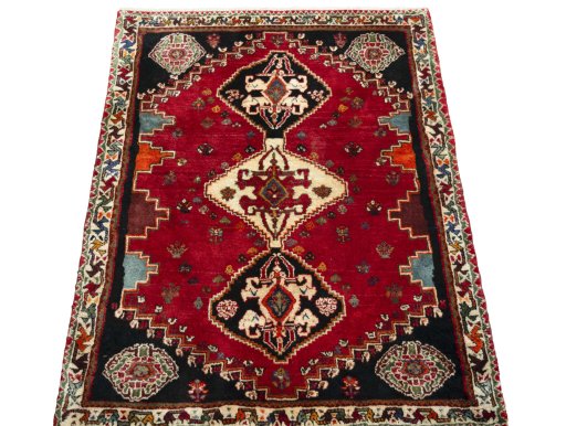 Surface texture of 2000s Shiraz rug with natural Wool and intricate pattern