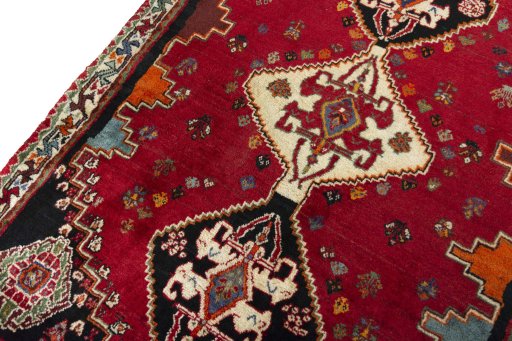 Backside of handmade 2000s Shiraz rug showing knot structure and weave density