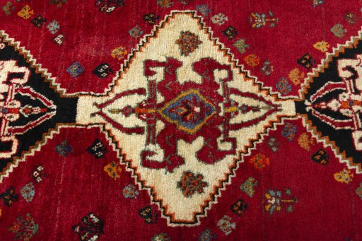Central medallion detail of 2000s Shiraz rug from Iran / Persia