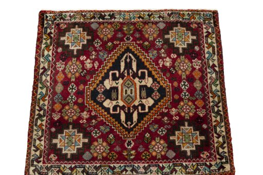 Surface texture of 1970s Shiraz rug with natural Wool and intricate pattern