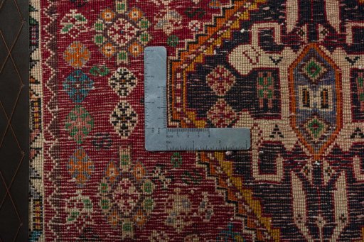 Backside of handmade 1970s Shiraz rug showing knot structure and weave density