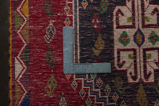 Backside of handmade 1970s Shiraz rug showing knot structure and weave density
