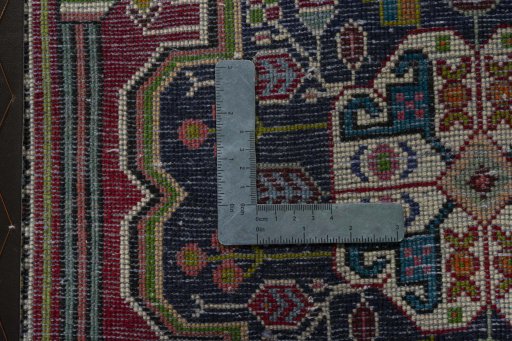 Backside of handmade 1970s Shiraz rug showing knot structure and weave density
