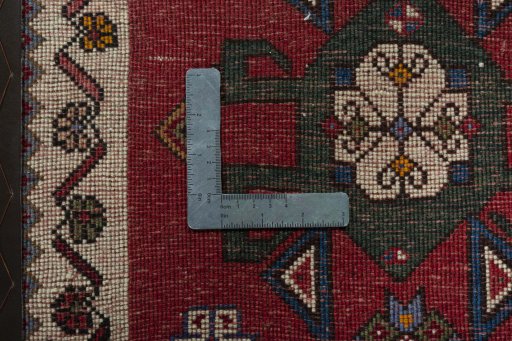 Backside of handmade 1970s Shiraz rug showing knot structure and weave density