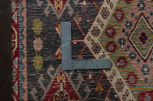 Backside of handmade 1970s Shiraz rug showing knot structure and weave density