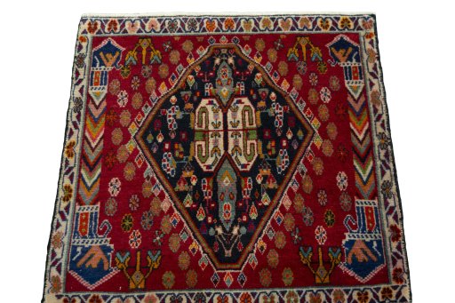 Surface texture of 1970s Shiraz rug with natural Wool and intricate pattern