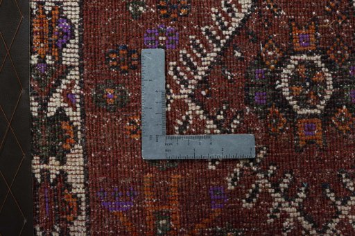 Backside of handmade 1970s Shiraz rug showing knot structure and weave density
