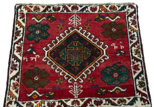 Surface texture of 1970s Shiraz rug with natural Wool and intricate pattern