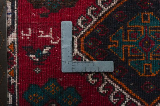 Backside of handmade 1970s Shiraz rug showing knot structure and weave density