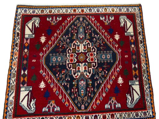 Surface texture of 1970s Shiraz rug with natural Wool and intricate pattern