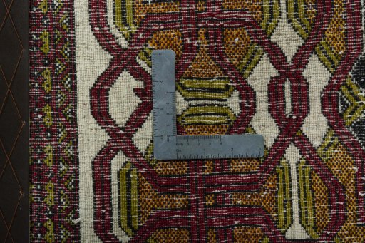 Backside of handmade 1970s Shiraz rug showing knot structure and weave density
