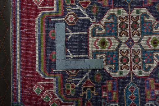 Backside of handmade 1970s Shiraz rug showing knot structure and weave density