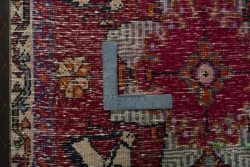 Backside of handmade 1970s Shiraz rug showing knot structure and weave density