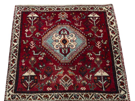 Surface texture of 1970s Shiraz rug with natural Wool and intricate pattern