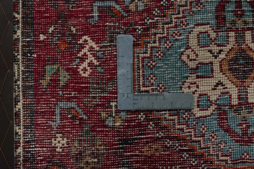 Backside of handmade 1970s Shiraz rug showing knot structure and weave density