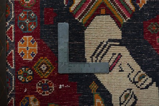 Backside of handmade 1970s Shiraz rug showing knot structure and weave density