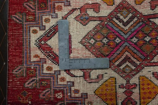 Backside of handmade 1970s Shiraz rug showing knot structure and weave density