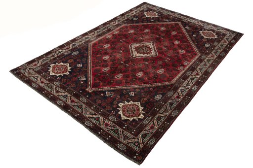 Corner detail of 2000s Shiraz rug showing border pattern and Wool pile