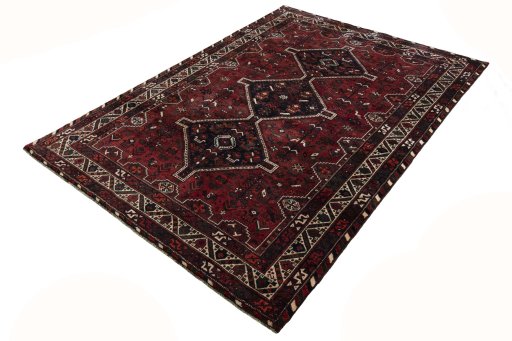 Corner detail of 2000s Shiraz rug showing border pattern and Wool pile