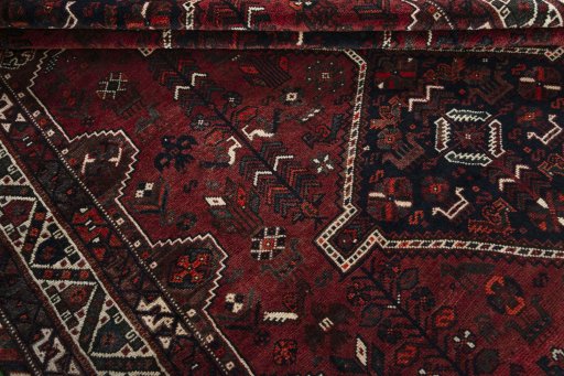 Full view of 2000s Shiraz rug from Iran / Persia, 307 × 213 cm in Red tones